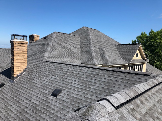 Architectural Roof with Stone Chimney