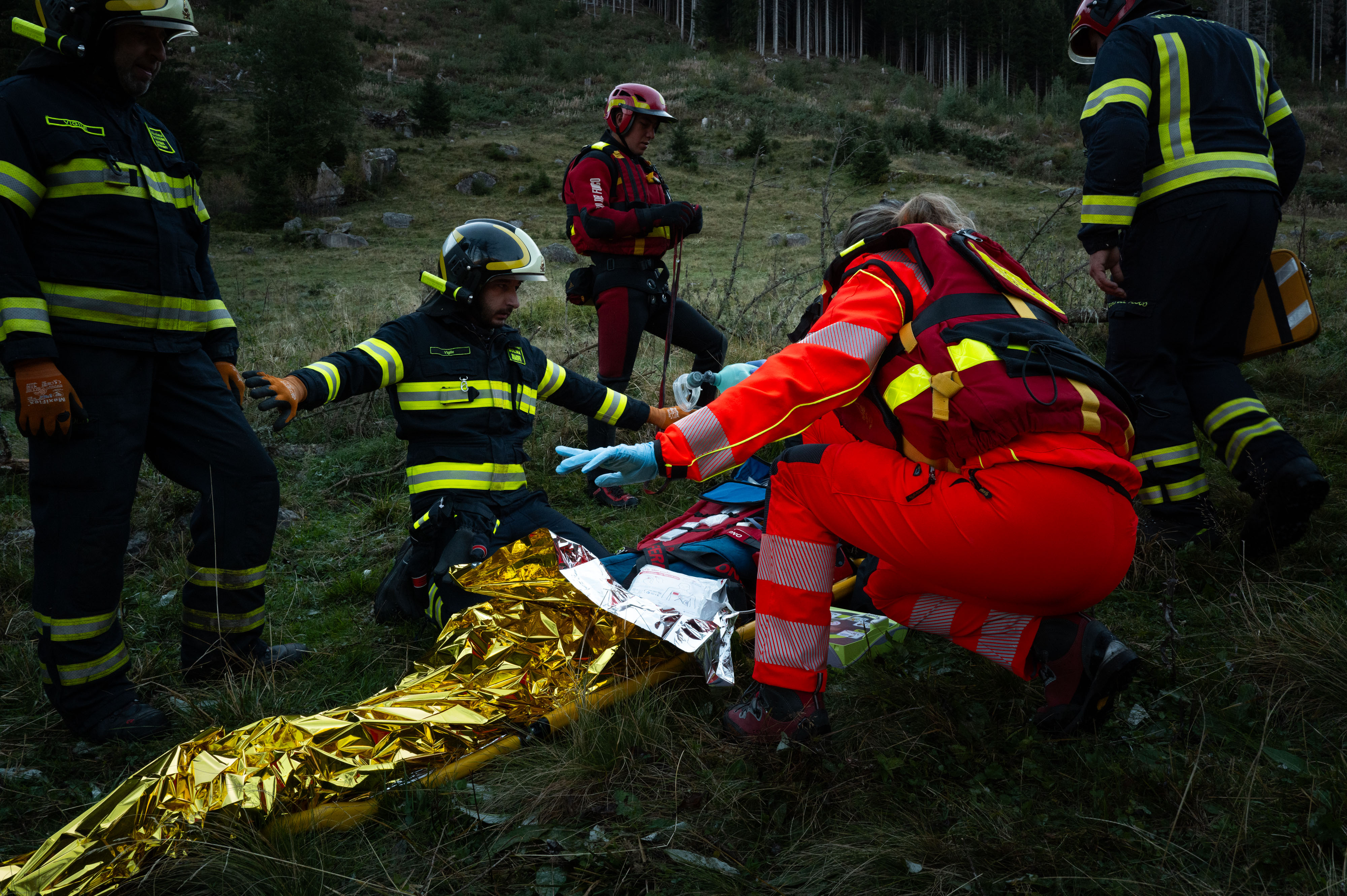 Rescuers performing resuscitation on the training dummy after the water recovery