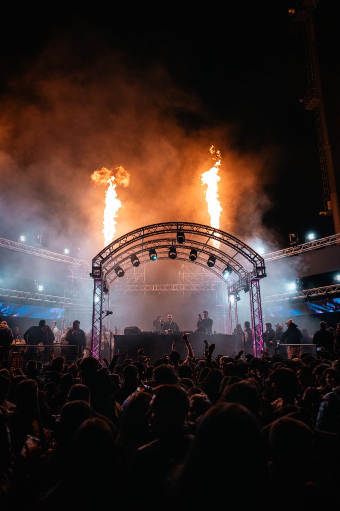 Main stage of the Fiemme Music Festival with the flames