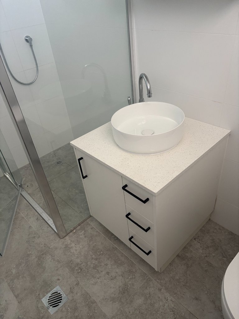 completed bathroom renovation plumbing Brisbane Northside — new vanity, basin and shower installed