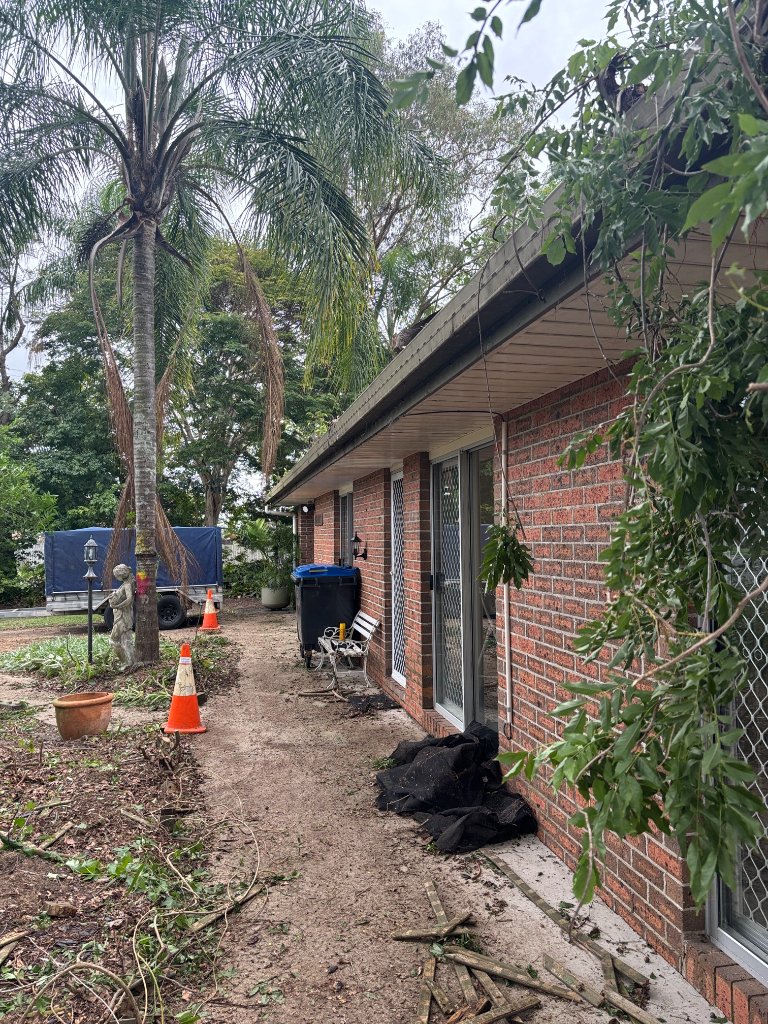 Before: Damaged gutters prior to repair