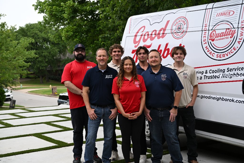 Good Neighbor Heating & Air team standing together in front of their service van in Tulsa, OK
