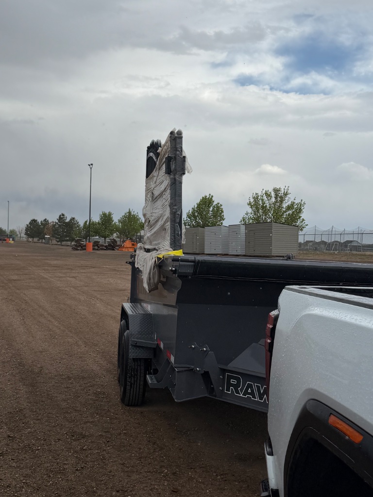 RawMaxx dump trailer loaded with materials Precision Rentals