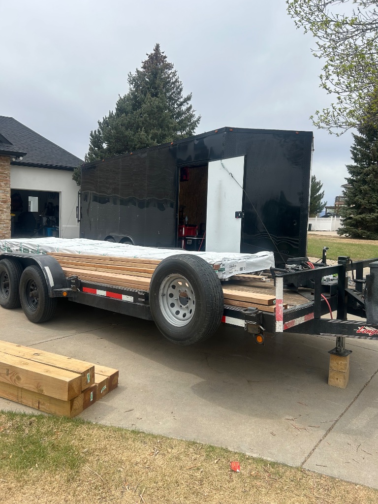Car hauler trailer with lumber load Precision Rentals Wellington CO