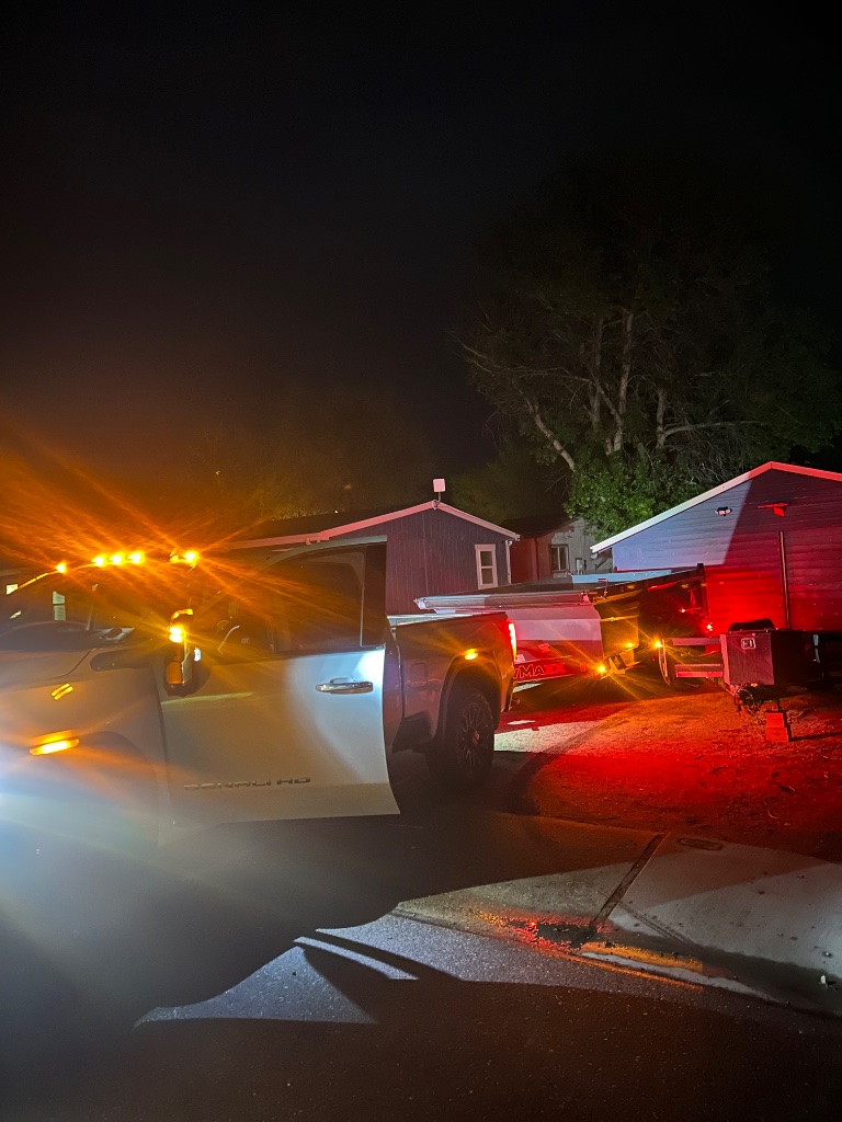 Night pickup GMC Denali HD with dump trailer Precision Rentals Wellington CO