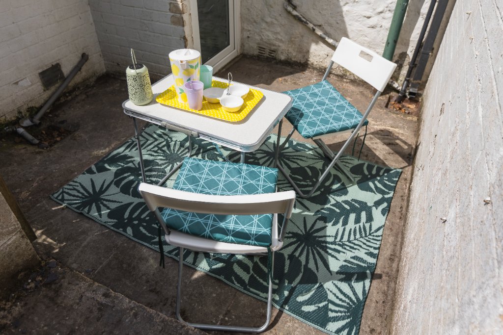 Outdoor seating area with table and chairs