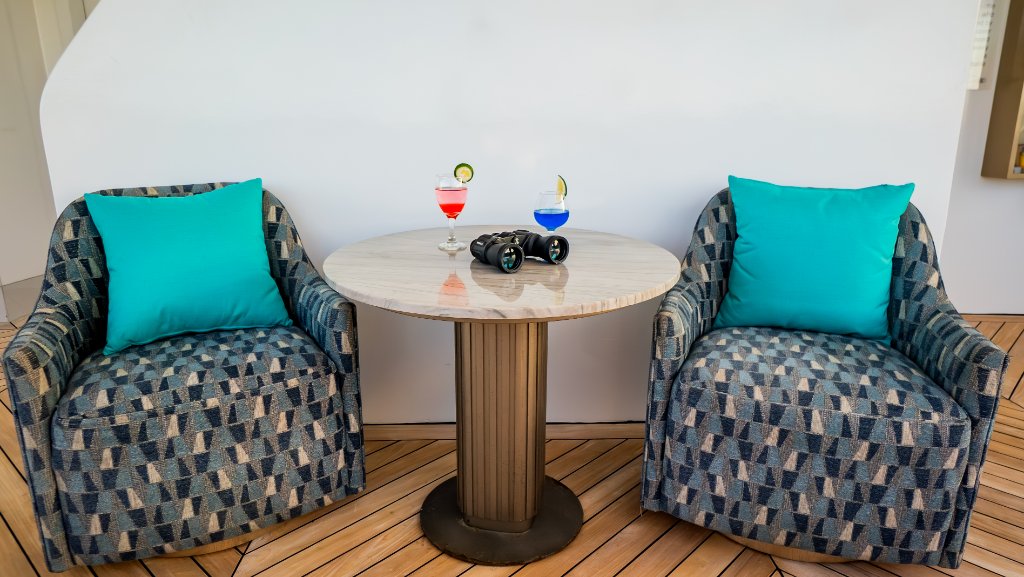 Terrace seating aboard M/C Elite overlooking the ocean