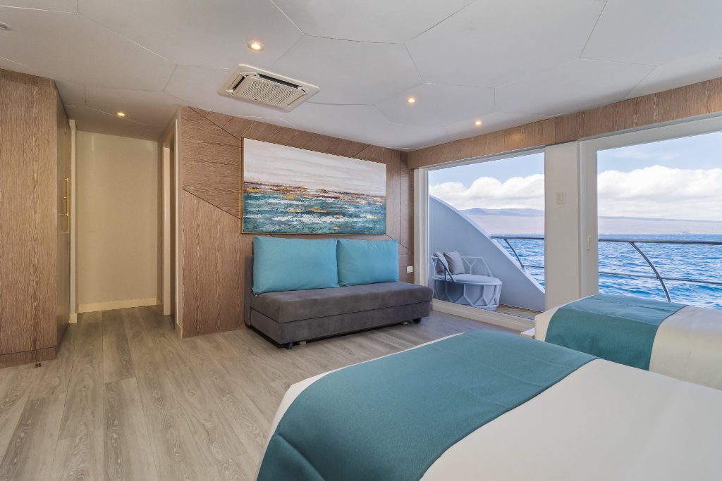 M/C Elite lower twin suite with ocean-facing balcony