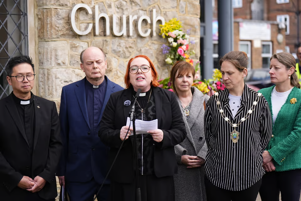 Reverend Catherine Hutton speaking to media outside Epsom Methodist Church