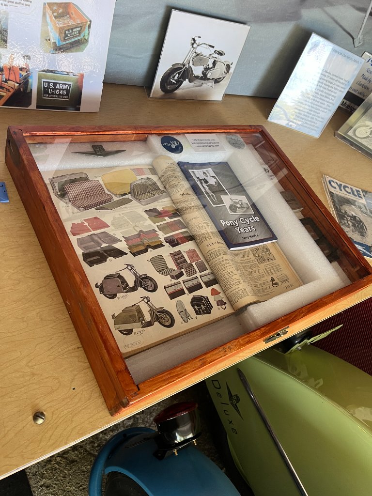 Display case with Pony Cycle memorabilia and documents