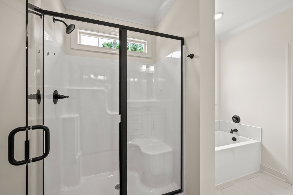 Primary walk-in shower and soaking tub