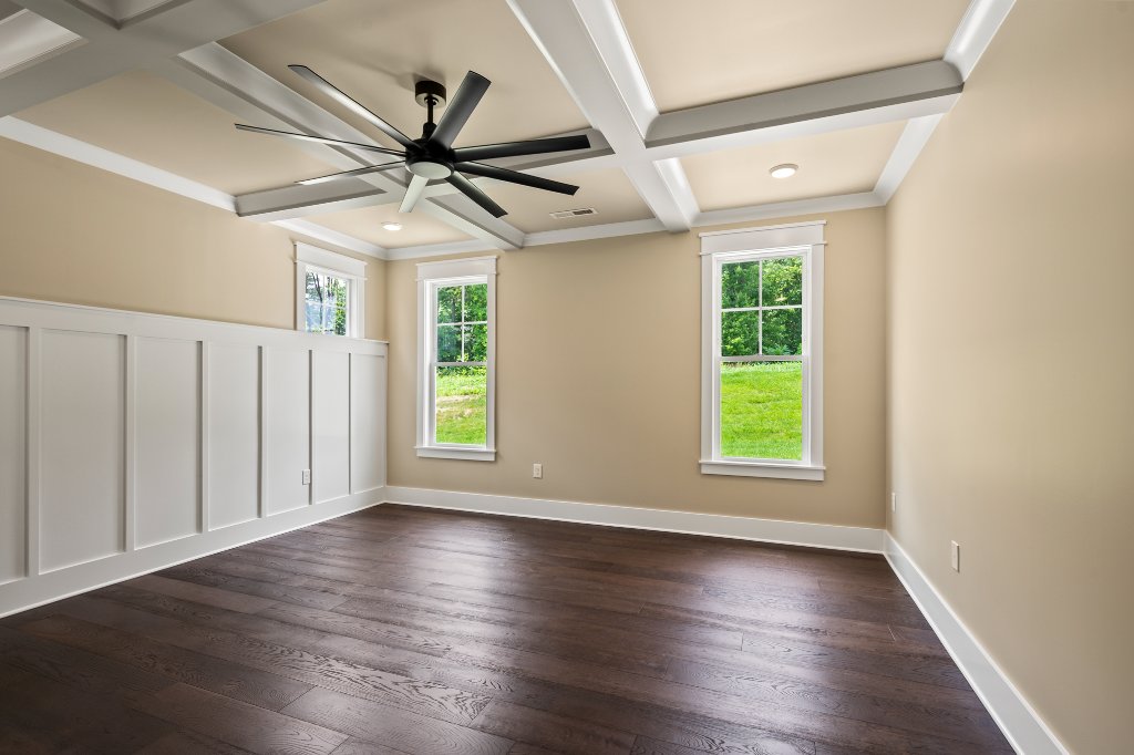 Primary bedroom with wainscoting