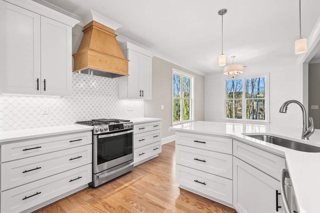 553 Alpine Road, kitchen range and custom wood hood detail.