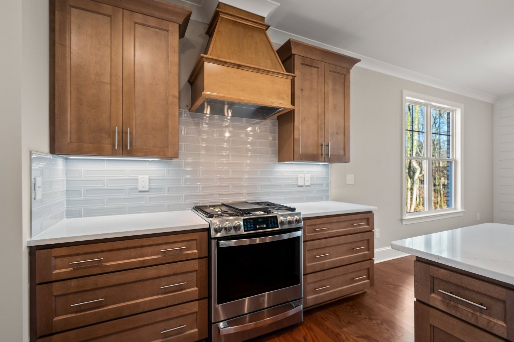 555 Alpine Rd. Kitchen range and custom hood detail.