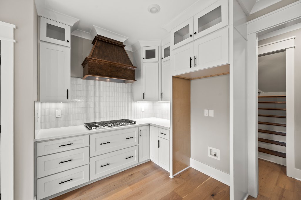 740 Surrey Path Trail, kitchen cooktop and custom wood hood