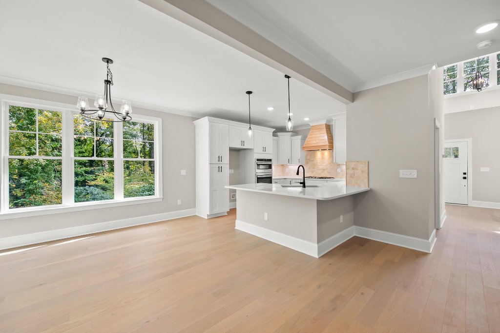 Kitchen with island and custom hood