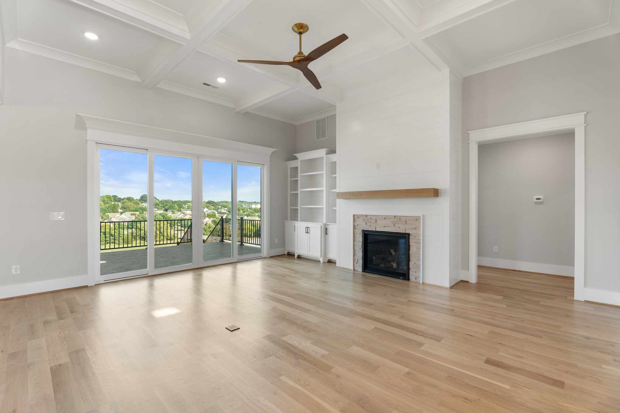 727 Royal Jasmine Ct - Living Room with Fireplace & Deck Access