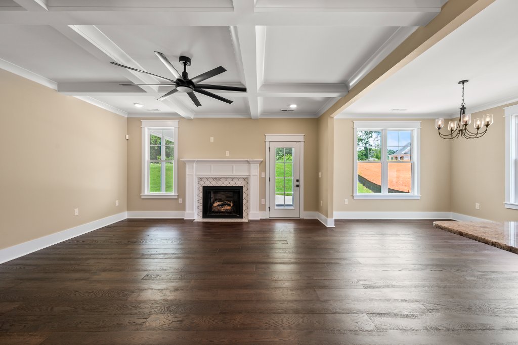 Great room with fireplace and coffered ceiling