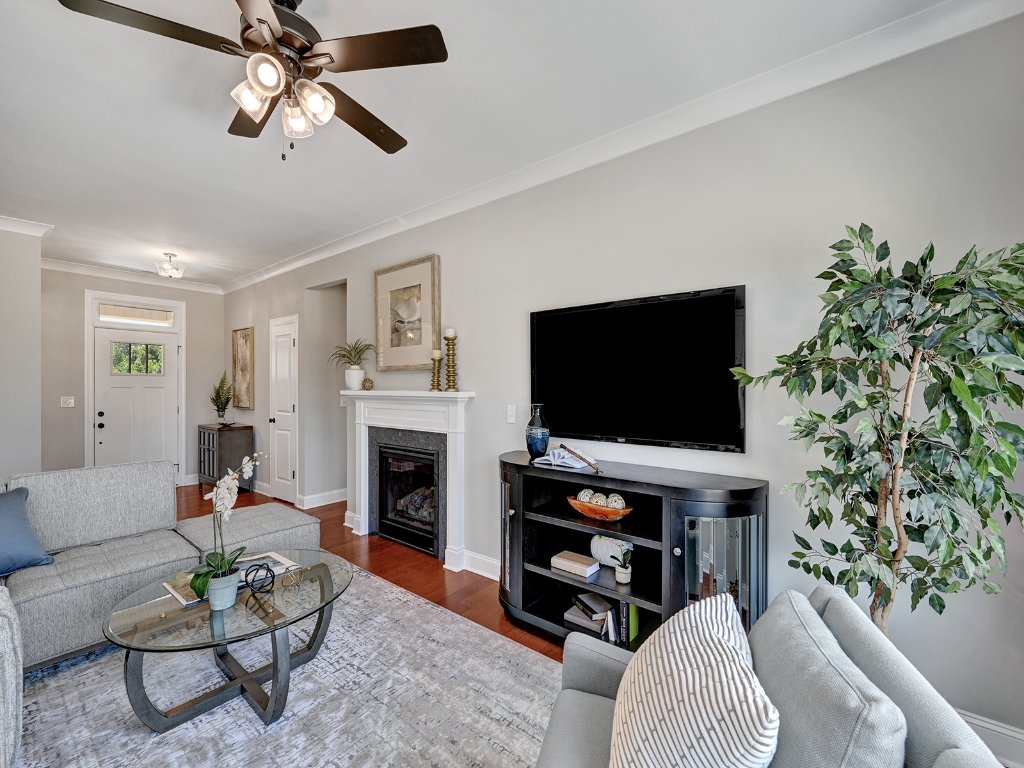 Living room with fireplace and TV