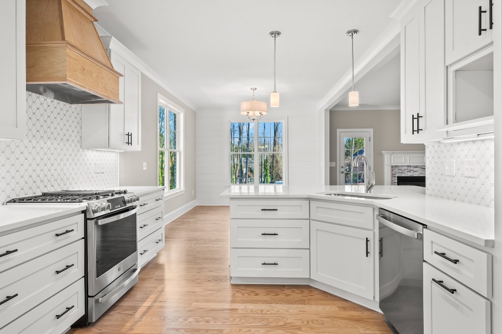 553 Alpine Road, large kitchen with white cabinets and custom hood.