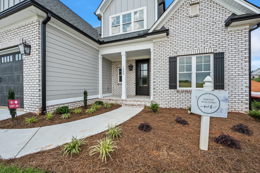 Front porch and entry with Dream Builders sign