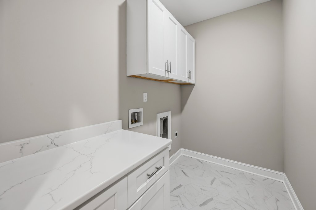 173 Cool Run, laundry room with quartz countertop and cabinetry