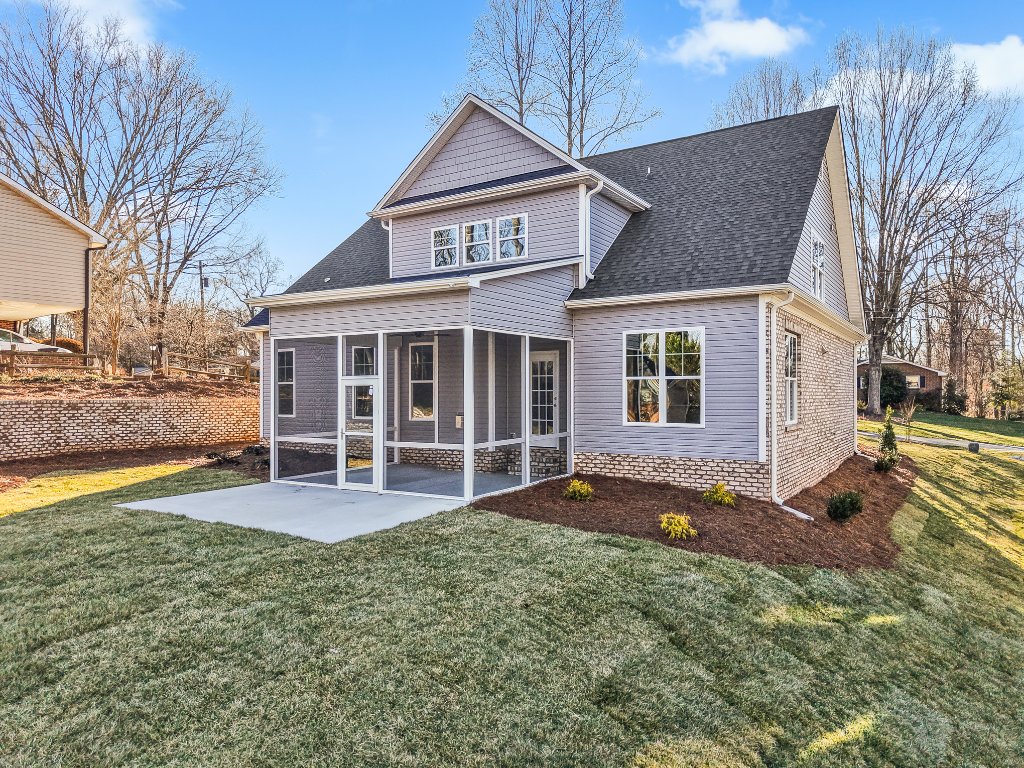 555 Alpine Rd. Rear exterior with screened porch.