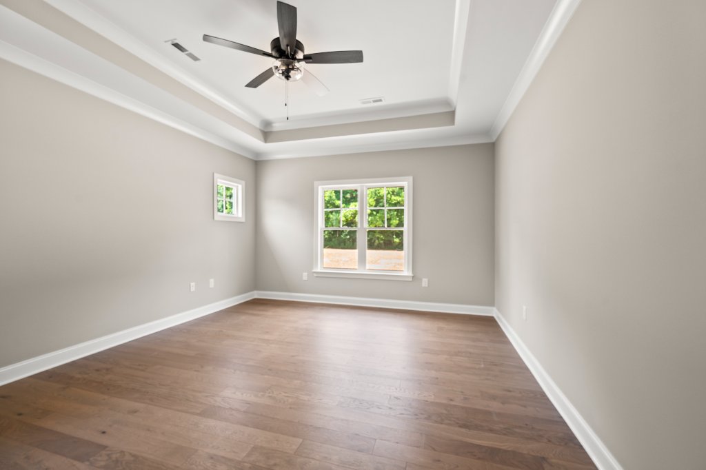Primary bedroom with tray ceiling