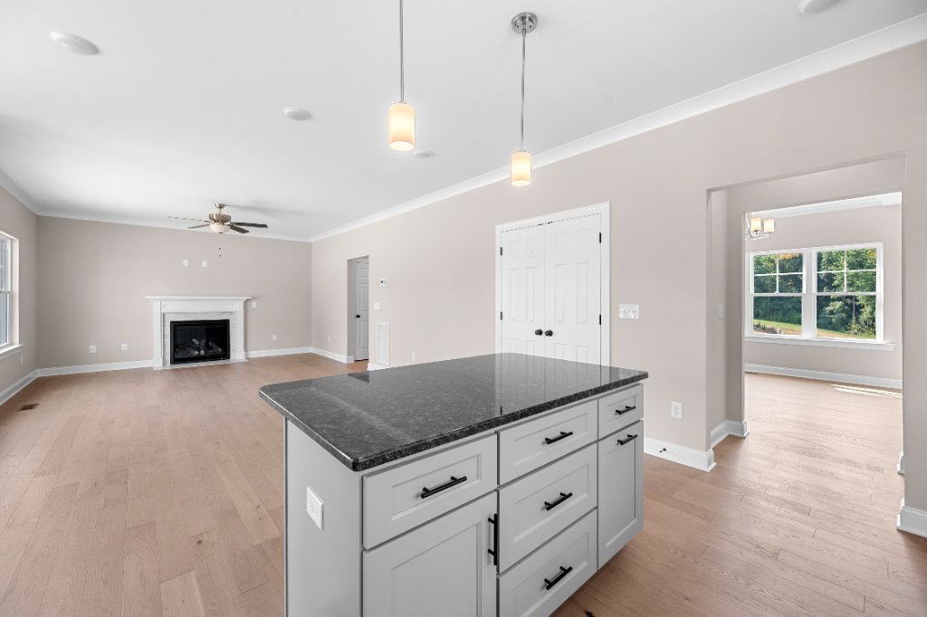 Kitchen island and living room with fireplace