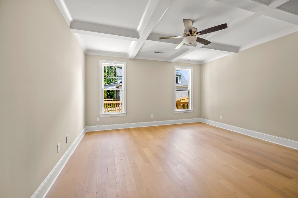 Primary bedroom with coffered ceiling