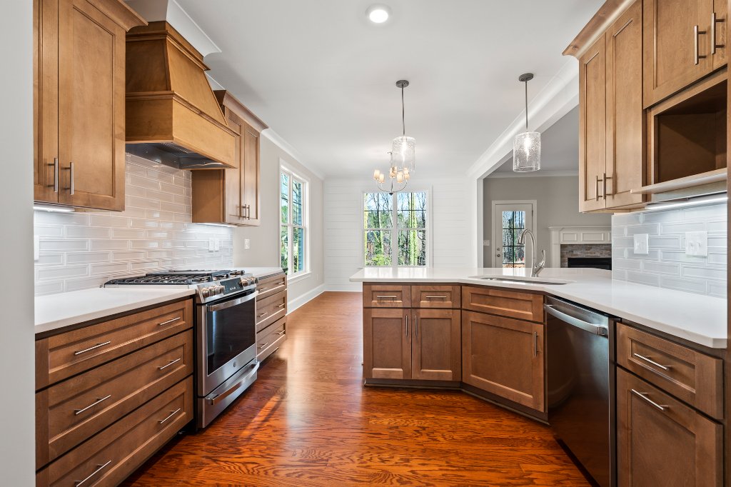 555 Alpine Rd. Kitchen with custom wood cabinets and stainless appliances.