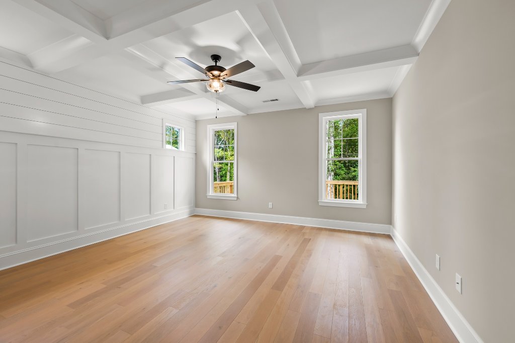 Primary bedroom with coffered ceiling