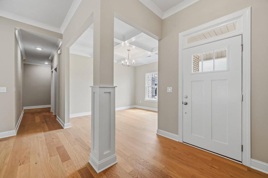 173 Cool Run, foyer entry with coffered ceiling dining room
