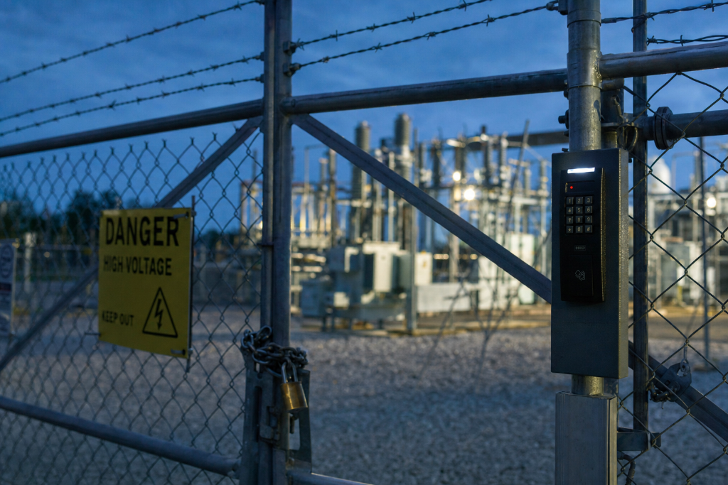 Substation access gate with keypad and warning sign