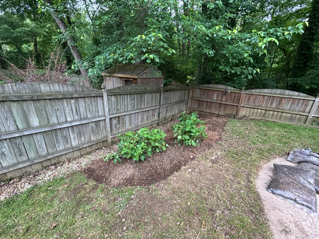Garden bed after fresh mulch and lawn care in Northern Virginia
