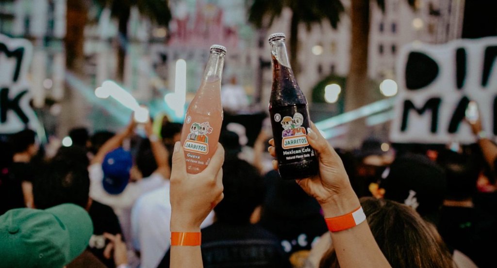 Cheers with Jarritos bottles