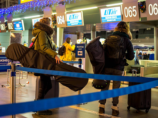 Lugging oversized ski bags through the terminal
