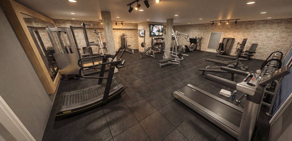 Strength and cardio zone of Preston Hollow private gym featuring cable machines, treadmills and pilates reformer