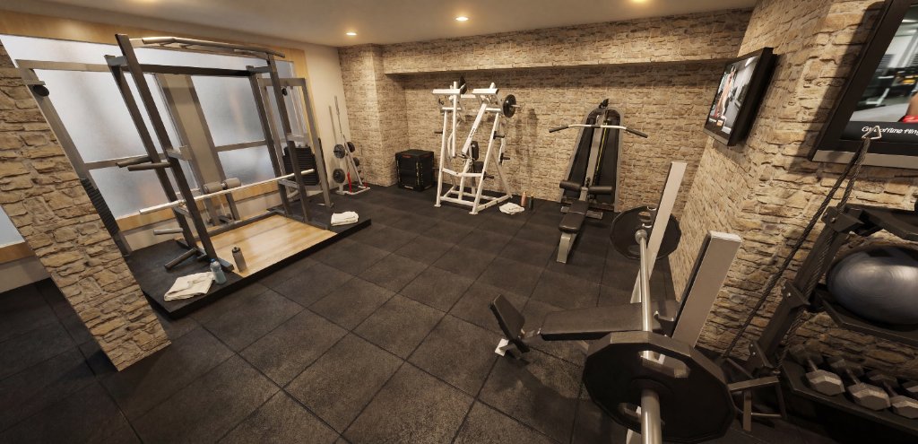 Selectorised strength machines and dumbbell rack in the Preston Hollow private gym with integrated display screens