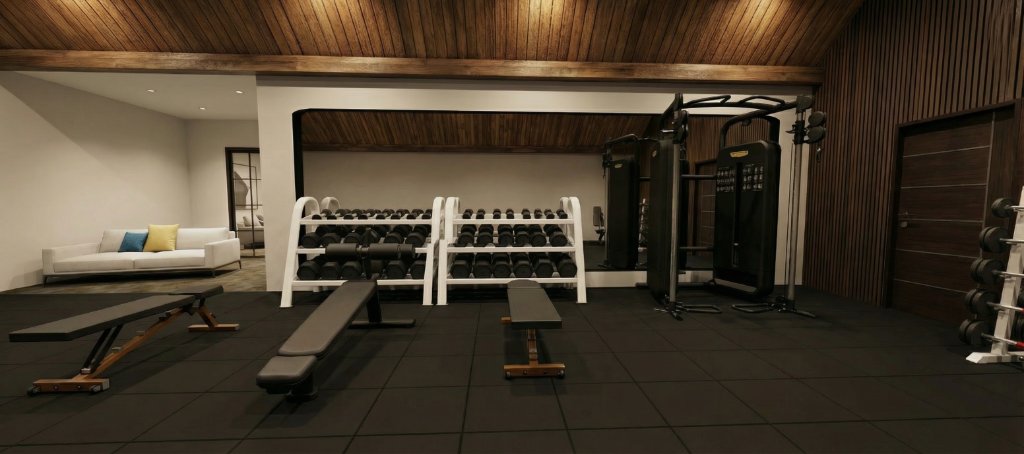 Highland Park estate gym dark-toned view showing dumbbell racks, cable system, cardio equipment and branded area rug