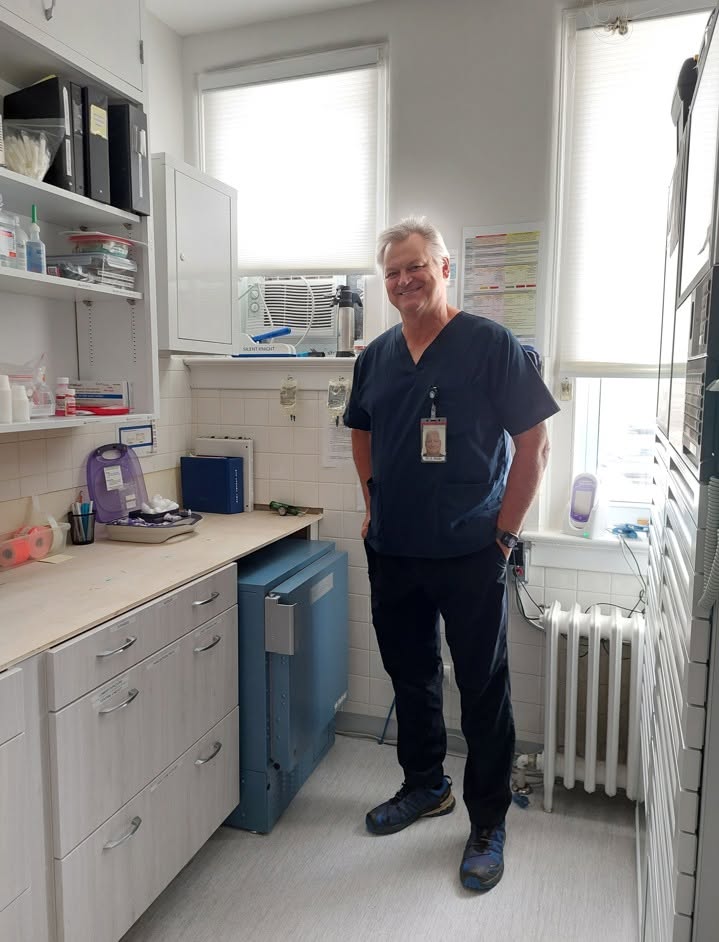 Dr. Bellar with the new blood fridge