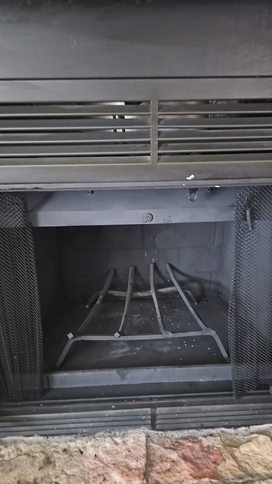 Clean fireplace insert after professional service