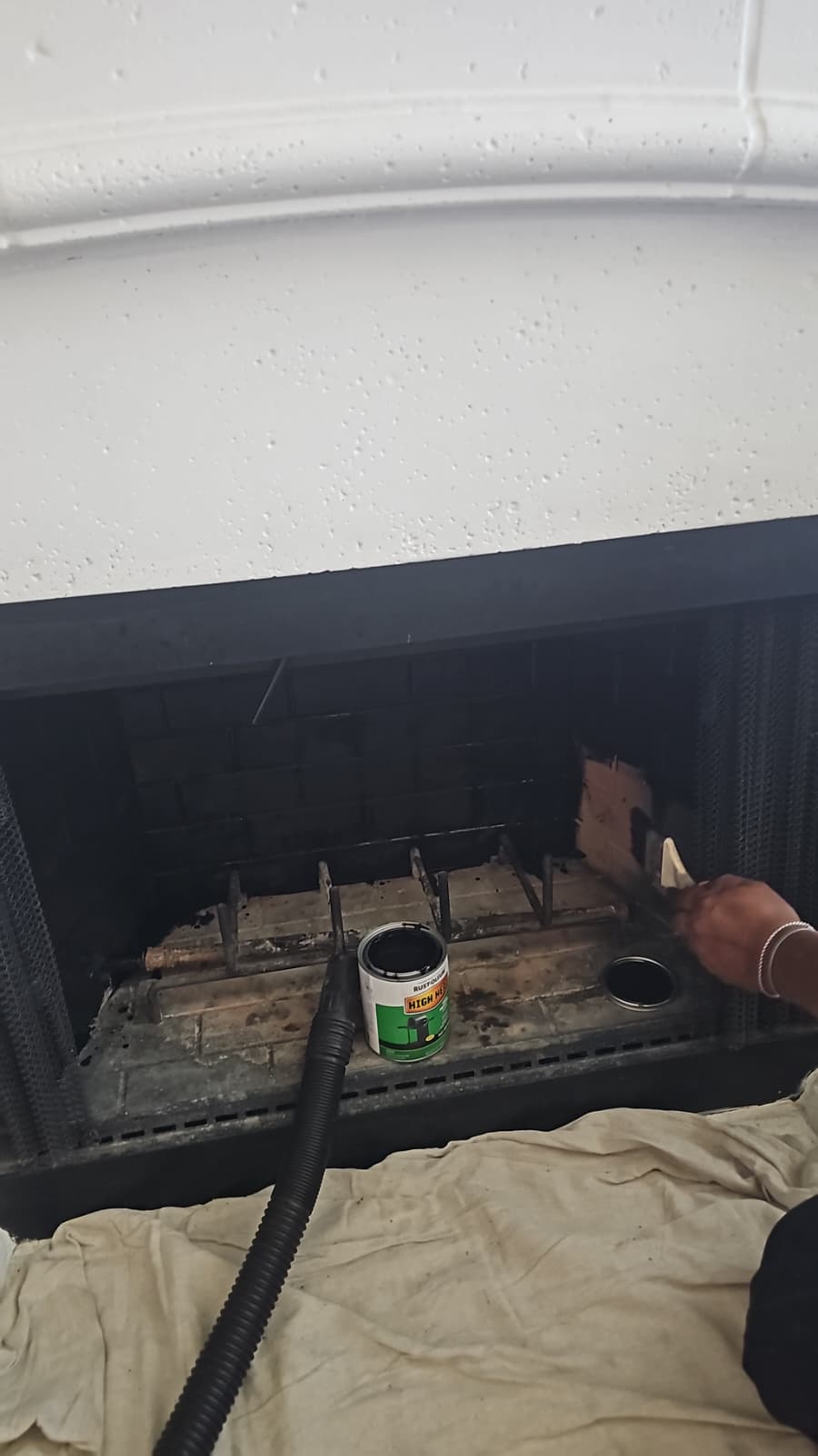 Firebox being painted with high-heat coating