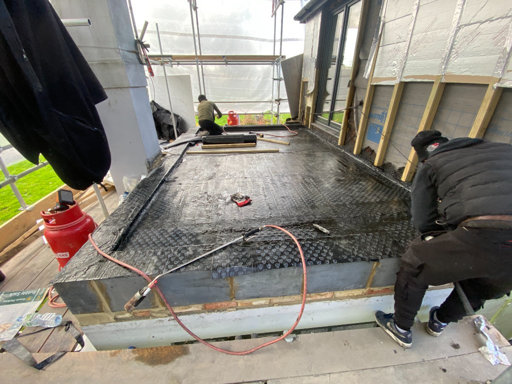 Flat Roofing — Team Laying Second Layer, Essex