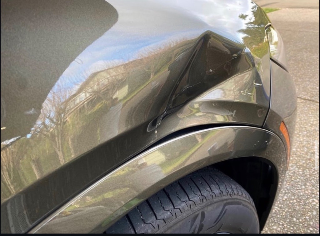 SUV — Fender Dent Before Repair