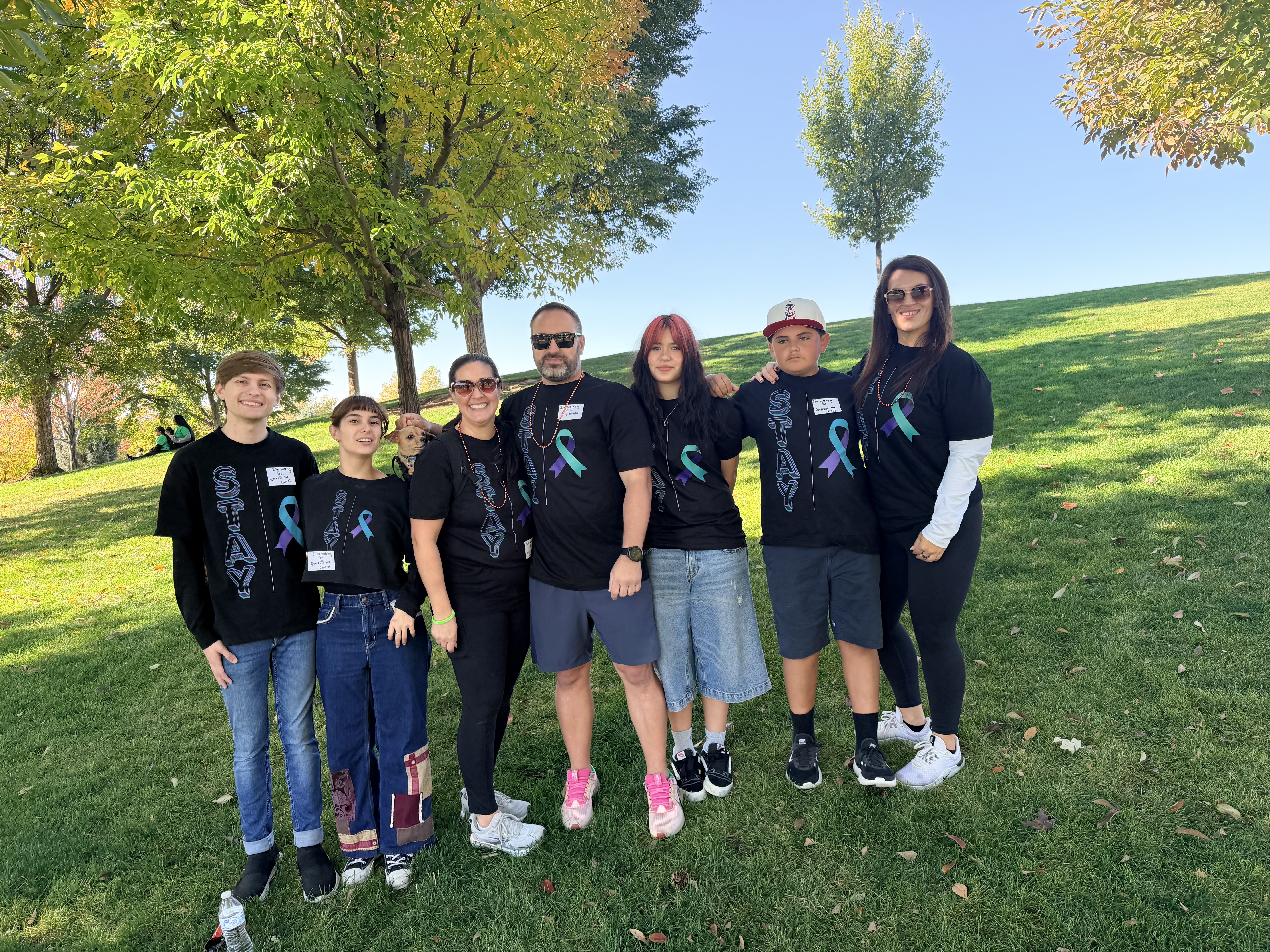 Crew photo on the hill in STAY shirts