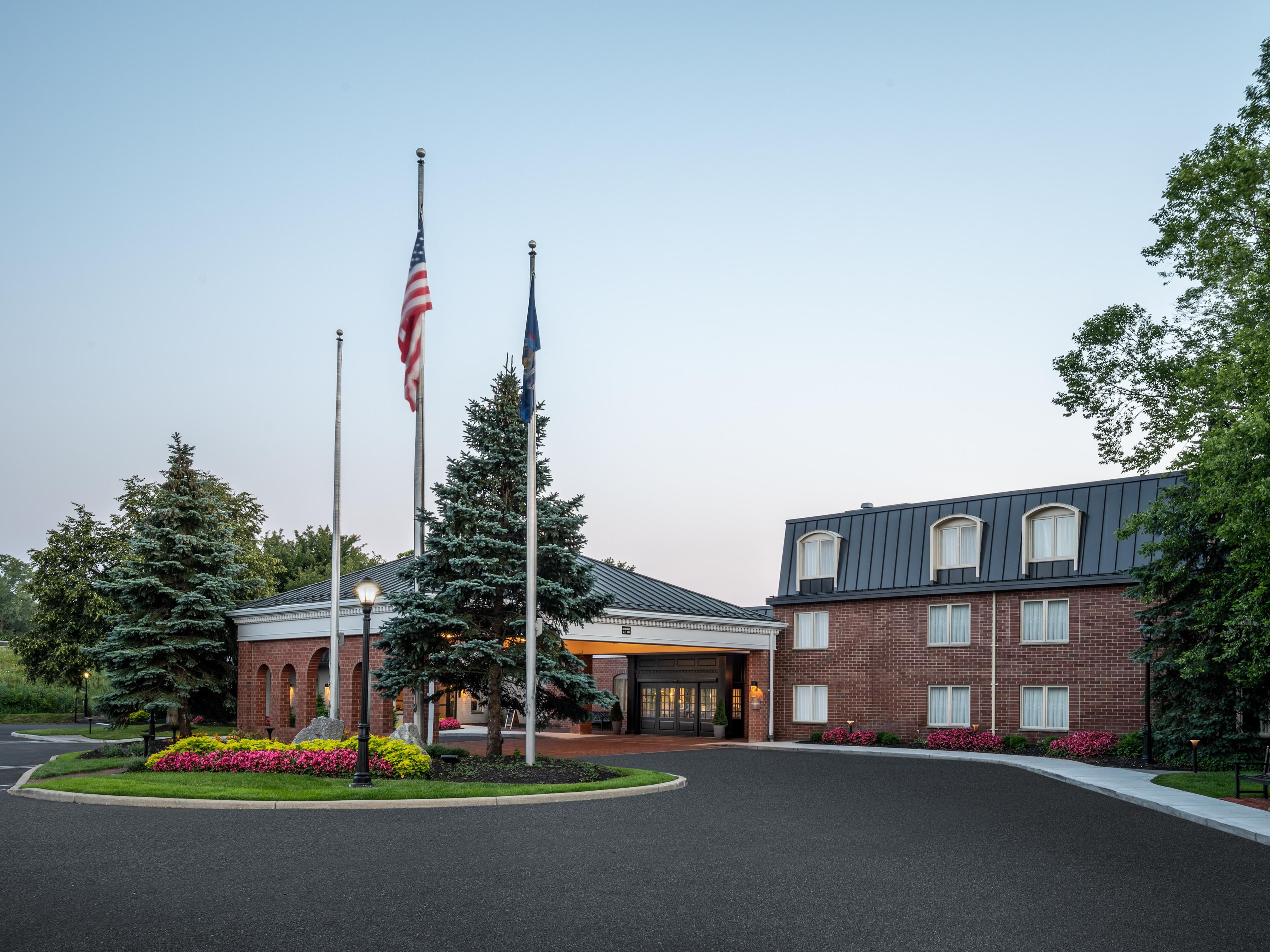 Venue exterior at dusk with grand porte-cochère entrance