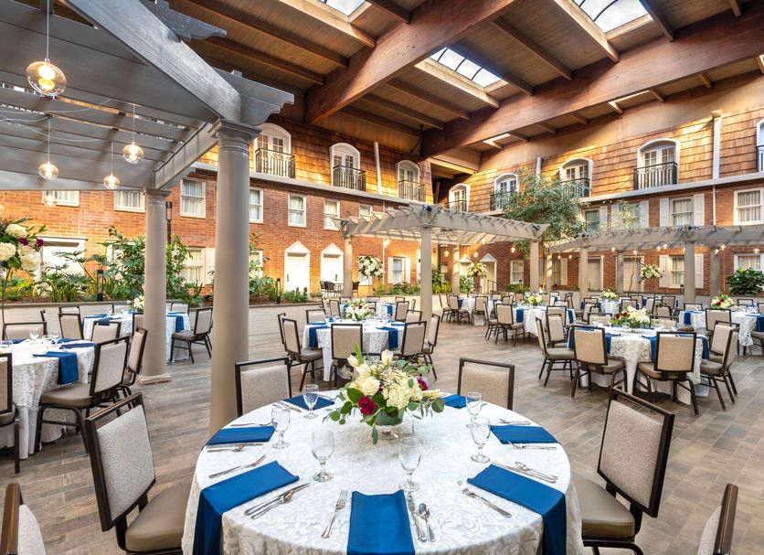 Elegant courtyard-style event space with warm pendant lights