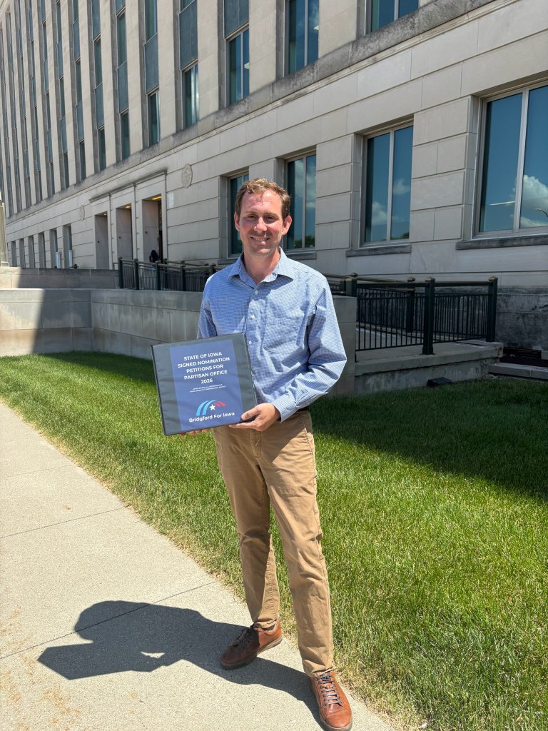 Michael Bridgford holding signed nomination petitions