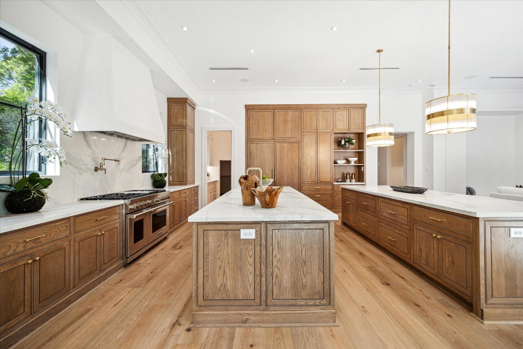 Warm Wood Kitchen with Marble Counters